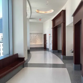 Hallway in the Nashville courthouse, featuring artwork and an abundance of natural light.