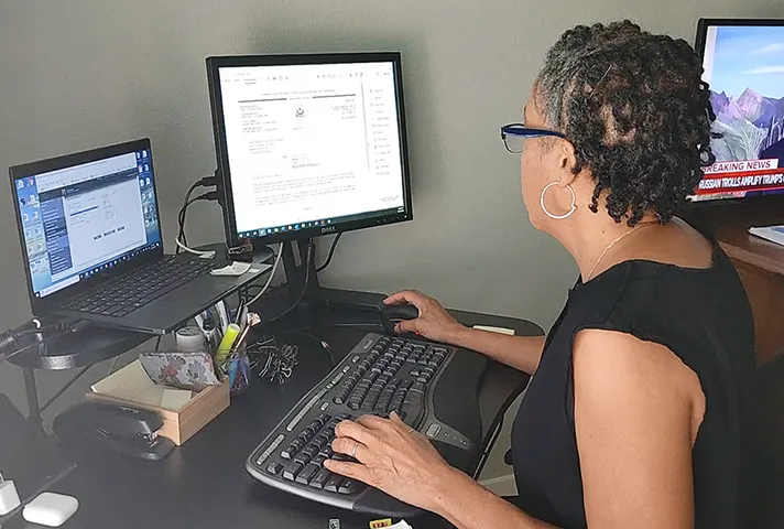 Marci Brown working in her home office